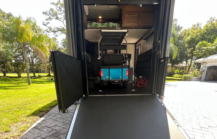 This custom ordered golf cart is the only make/model available in the US that fits in the toy hauler garage.