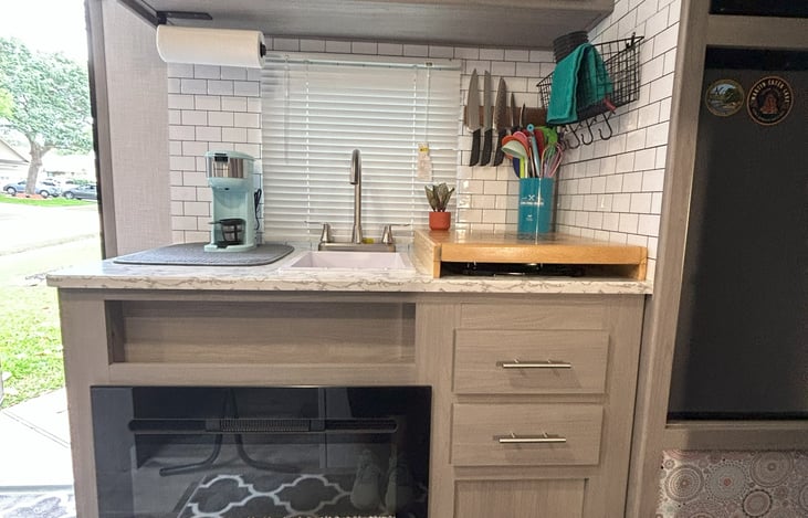 View of Kitchen and Fireplace.