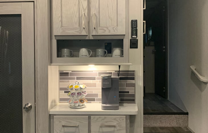 Coffee station with Keurig machine that makes  iced and hot coffee. K-cup coffee pod's included.