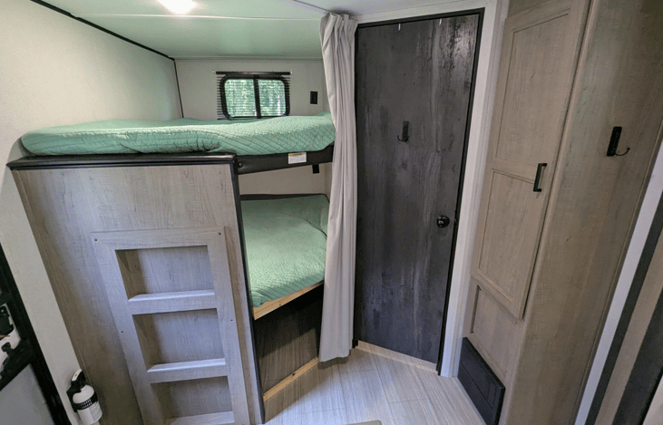 Large cozy bunks with USB charging ports.