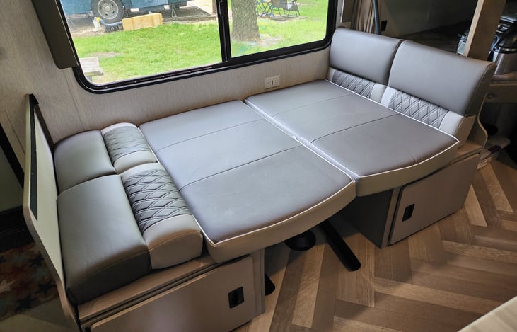 The dinette drops down into another bed