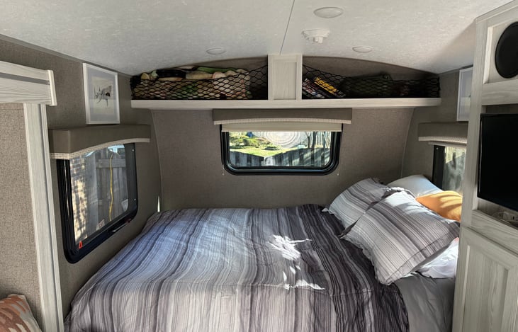 Queen size bed complete with memory foam mattress cover for a really good night sleep!