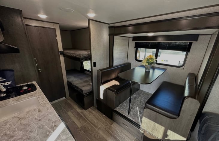 View of the bunk beds and dining area from the door