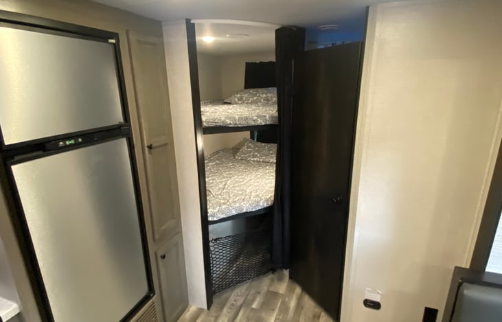 Bunk bed view and restroom entrance to the right