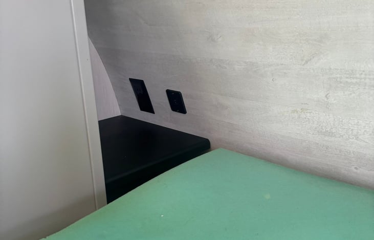 Night stand w/outlets.