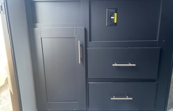 Storage as you walk in under the sink.