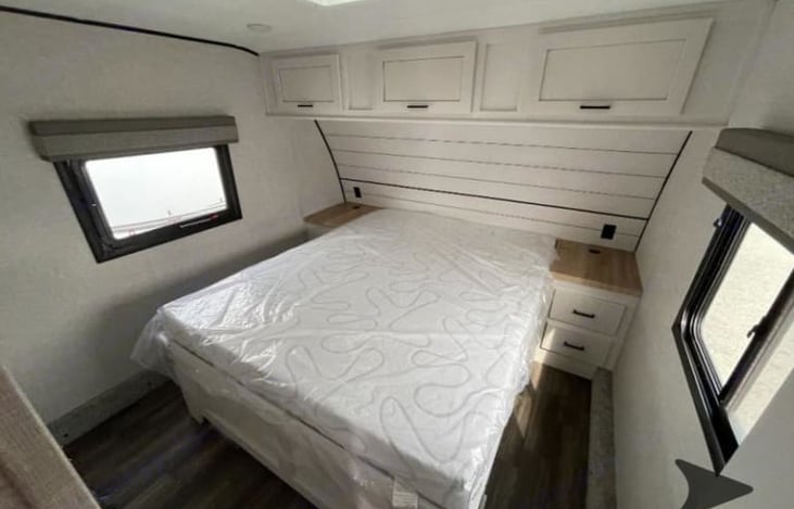 Private master bedroom up front with comfy queen mattress.