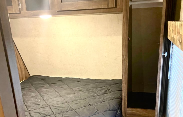 Bedroom with short queen bed