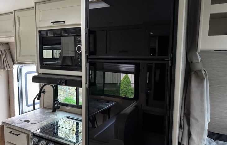 Range, microwave, sink, refrigerator and freezer