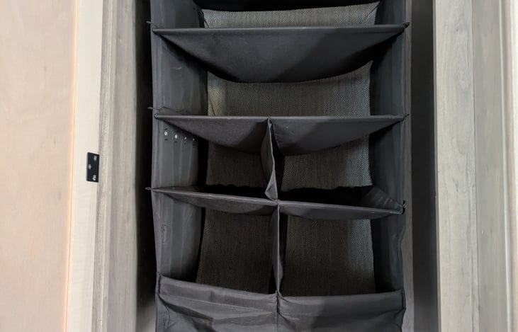 Easy access to check level of each tank. Located between the bathroom and the refrigerator.