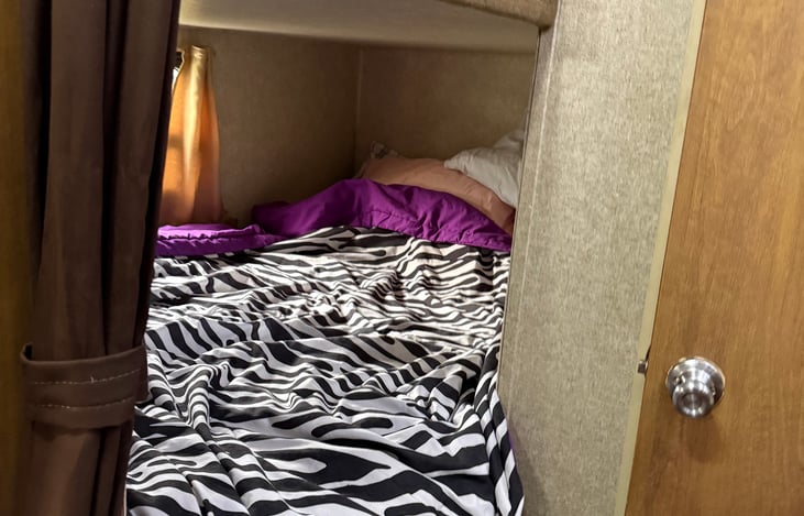 Bunk area. We currently use the top bunk as storage but will include the mattress if top bunk is needed.