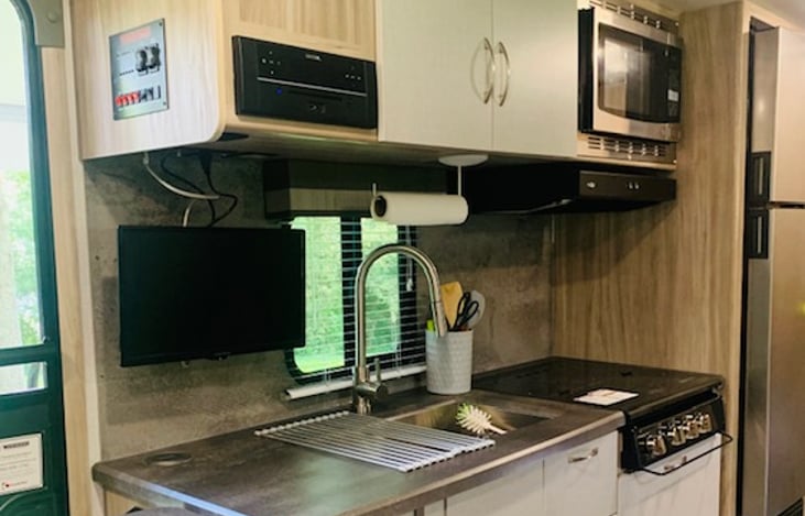 1.1 cubic ft. convection microwave
Recessed 3 burner cooktop with backlit knobs and glass cover
Undermount stainless steel dual bowl sink with cover