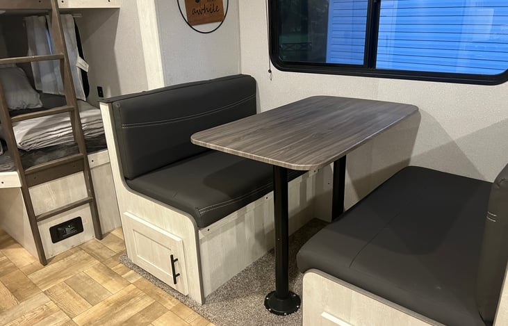 Dinette between bunks (left) and sofa (right)