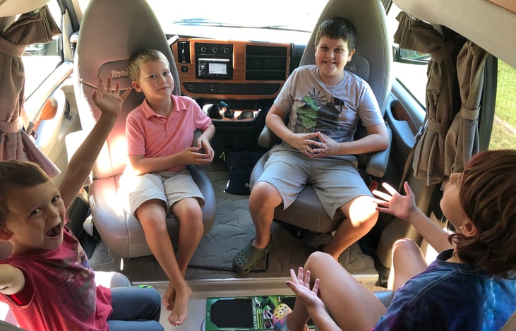 Four belted front seats. Driving area all day, lounge space when you arrive!