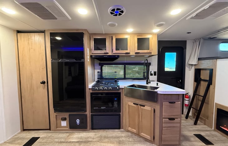 Kitchen and pantry with built-in speakers in ceiling and double AC