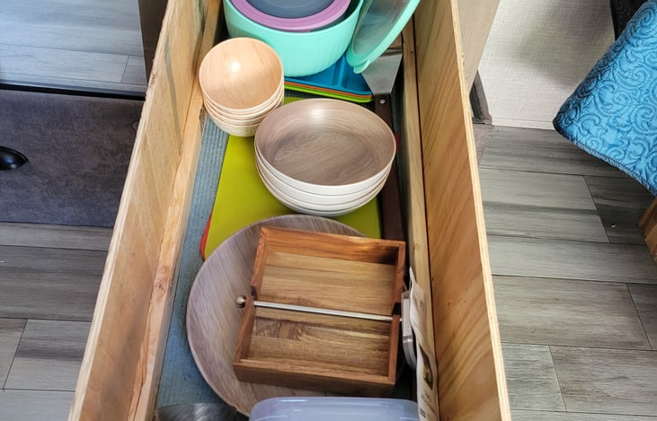 enough dishes for 3-4 people, cutting boards, napkin holder, etc.