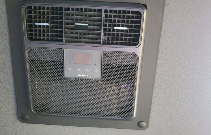 A battery powered A/C unit is provided which can be used for cooling when parked.