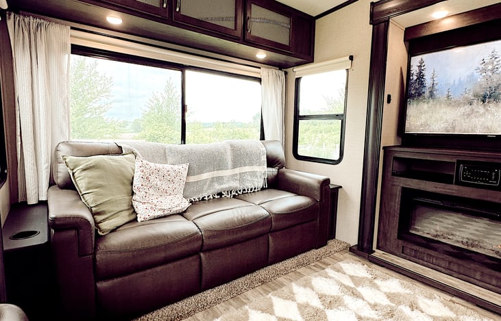 Very comfortable large couch that can be converted into a queen bed.   Trendy decor with updated curtains and a soft rug.