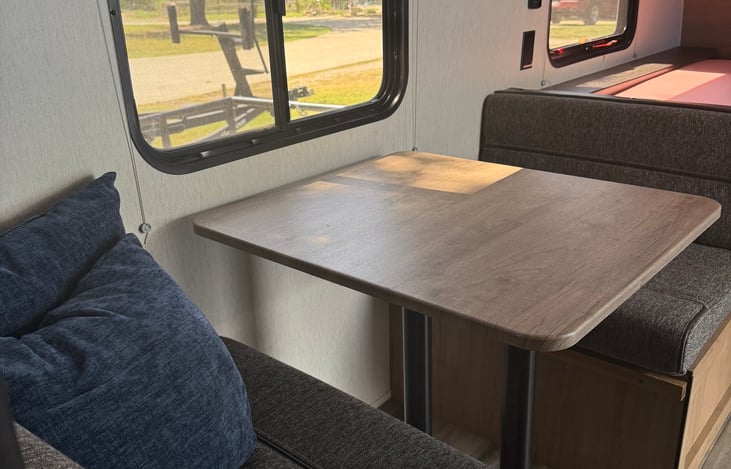 Kitchen seating converts into additional bed.