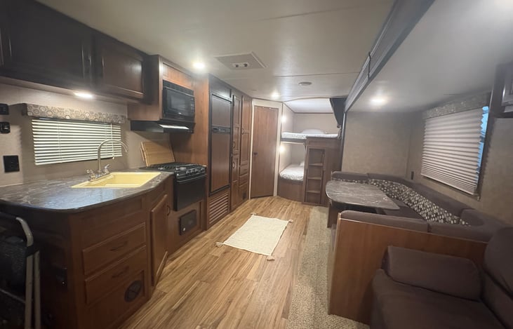 Photo taken from in front of entertainment center where there is. A 32” smart Roku tv available for your use.