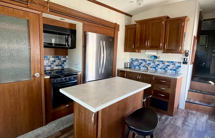 Fully equipped kitchen with large island.