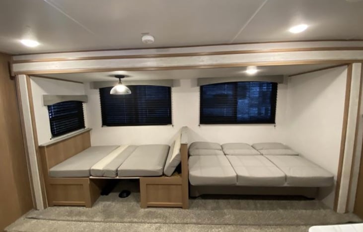 Couch and dining table turned into beds if needed