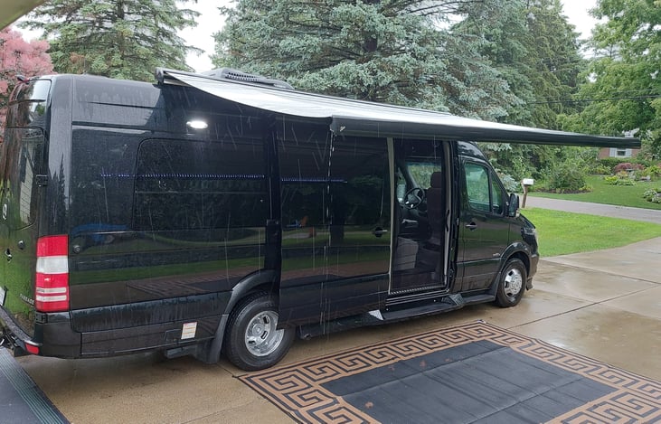 The awning is self retracting under windy conditions. It is great for keeping drips off the seats on a misty day.