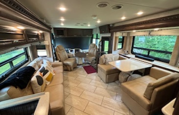 The 3 slides provide a large open footprint for your guest. The couch turns into a King & the dinette table is a single.