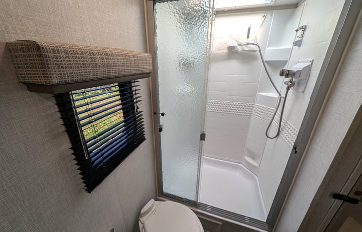 Large shower with handheld shower head