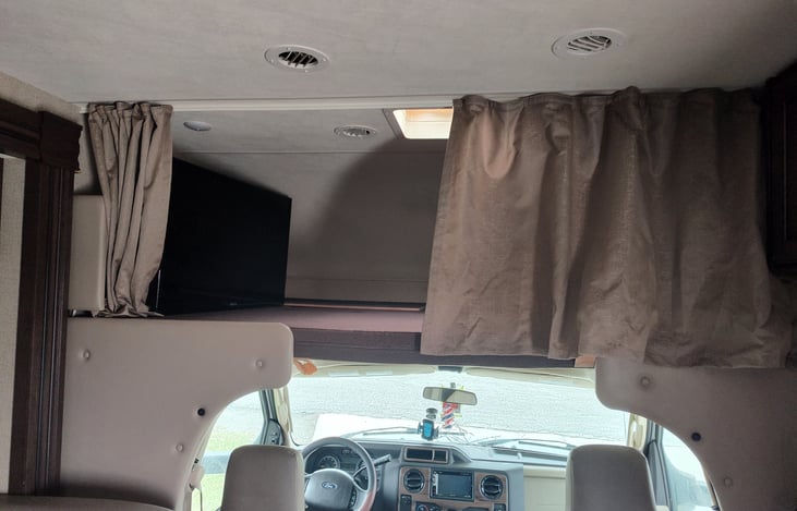 Full size above cab bed. TV located here.