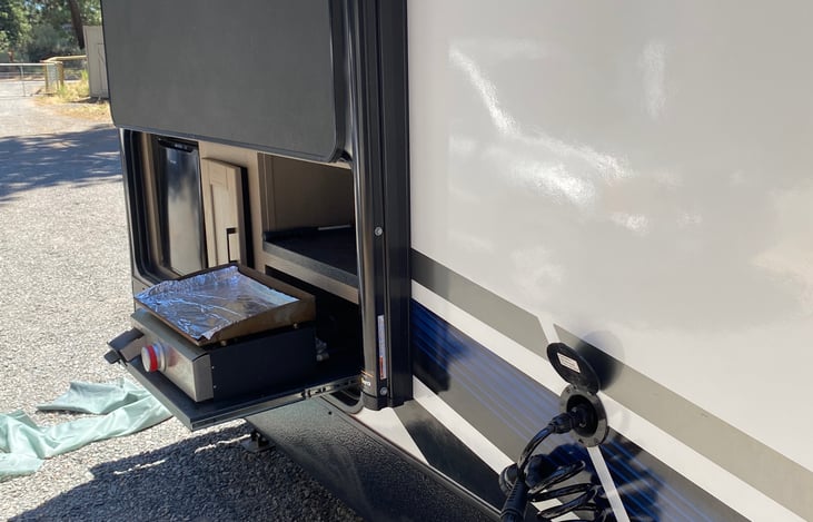 outdoor grill, fridge, and water