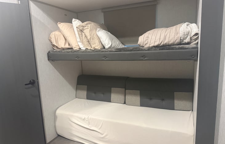 Bottom ‘couch’ folds out into a queen bed