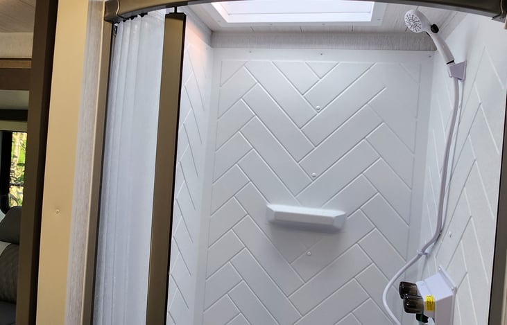 Tall & Wide shower with sliding door.  Soap, shampoo & conditioner included.