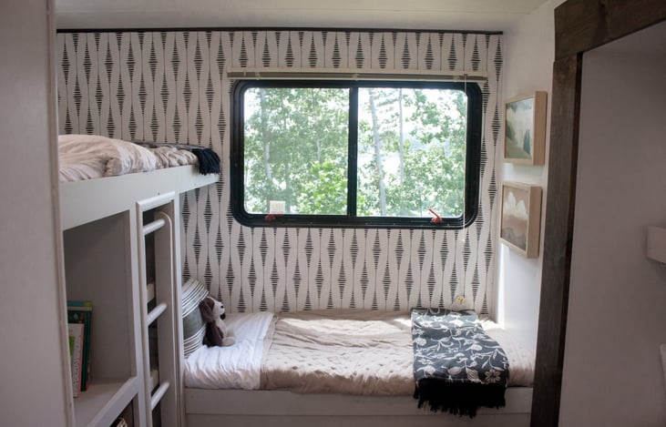 Unwind in the bunkroom with a view, where nature's beauty becomes your backdrop for unforgettable adventures.