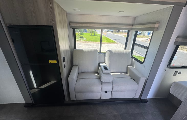 Cozy sofa with recliners and privacy shades