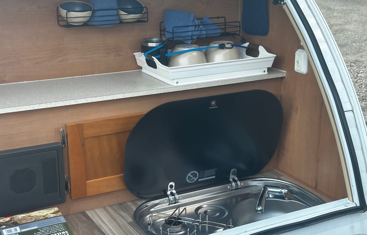 Comes equipped with dishes for two.