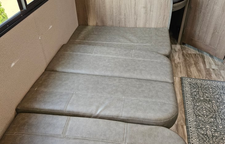 Dinette table collapses for an additional sleeping space