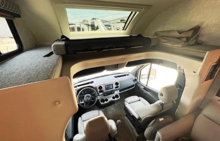 If preferred cushion can be removed from bunk to allow for extra maneuvering room into and out of the cab, as well as allow the natural light into the entire living space.