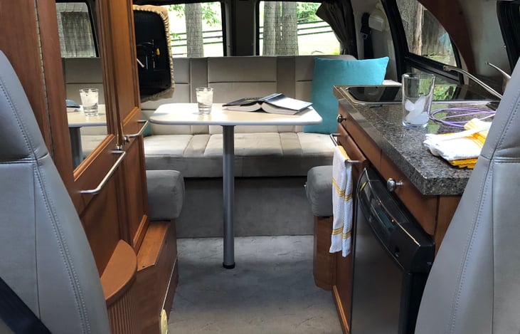 There are two removable tables, one for the front seating area and one for the back.