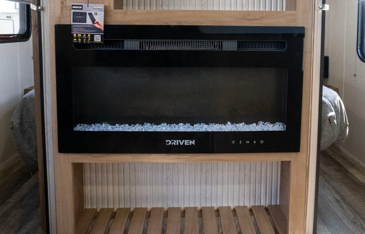 Electric fireplace with heat and ambient lighting mode