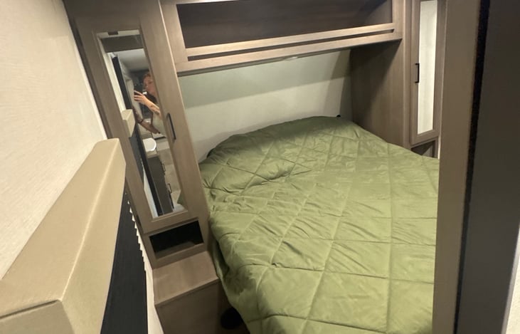 This cabinet contains a rod to allow the renter to hang clothes up.