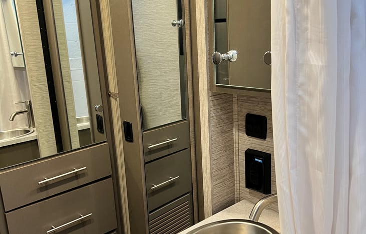 Bath doors swing open to make a big bathroom