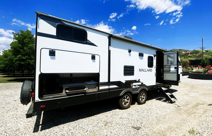 Our Heartland Mallard travel trailer — easy to tow and ideal for exploring El Capitan State Beach, Glamis, or Bonelli Bluffs RV Resort.
