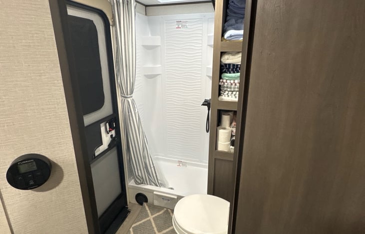 Full stocked bathroom with towels, wash cloths, toilet paper, beach towels and hand soap.