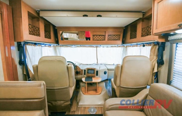 Cockpit area.  convenient coffee table to be put in place.  Chairs swivel to offer additional converstional space.