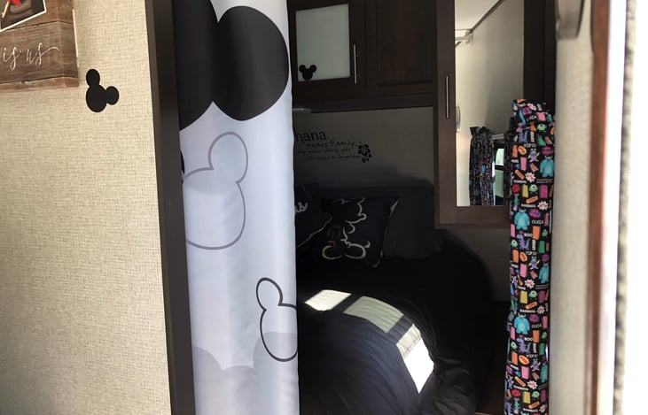 When it’s time for the grown ups to retire you’ll love ducking behind our Mickey curtain for your own space. 
Bedding provided:
Sheets, blankets 
Pillows- standard x2
Body pillow x1