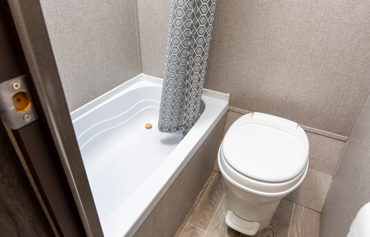 Small Bath Tub/Shower and Flushable Toilet