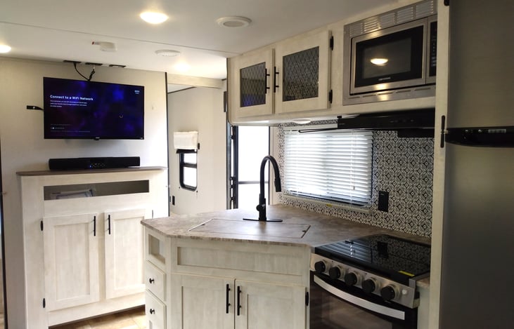 Nice Kitchen with over-head and under sink cabinets, pantry, drawers, under sofa and dinette storage. Broom and Swiffer Wet-Jet included.