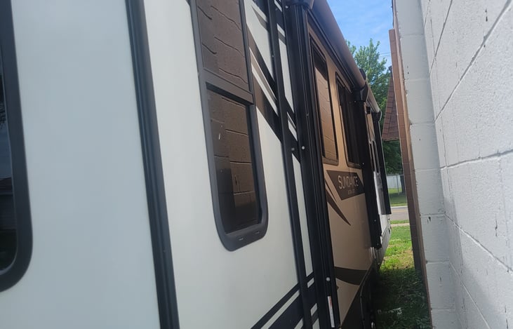 entrance side of the trailer, 2 awning, 1 slide out, heavy duty stairs