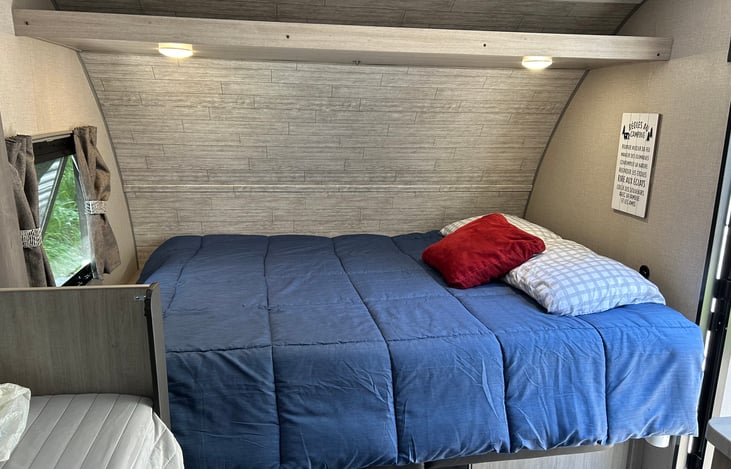 Queen-sized murphy bed above the couch.
